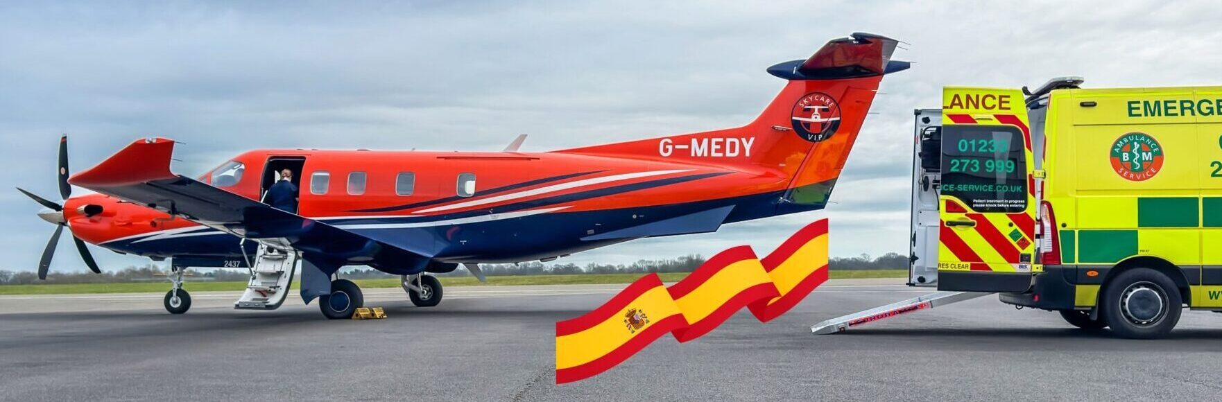Air ambulance at Malaga Airport loading a patient from ground ambulance for medical repatriation to the UK