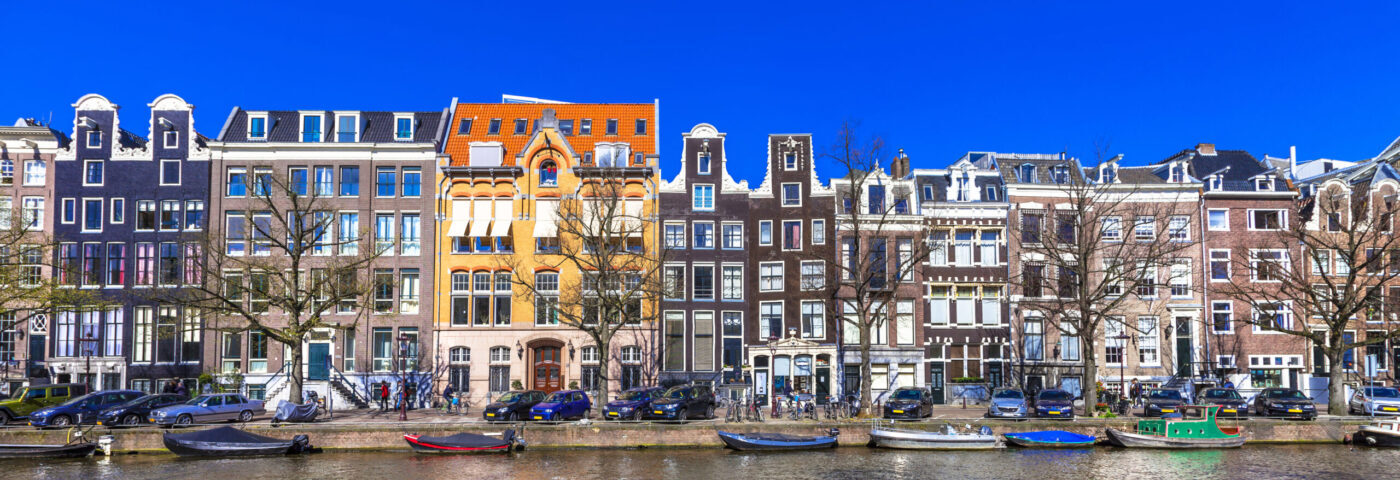Amsterdam canals on a sunny day – symbolising air ambulance repatriation from the Netherlands to the UK