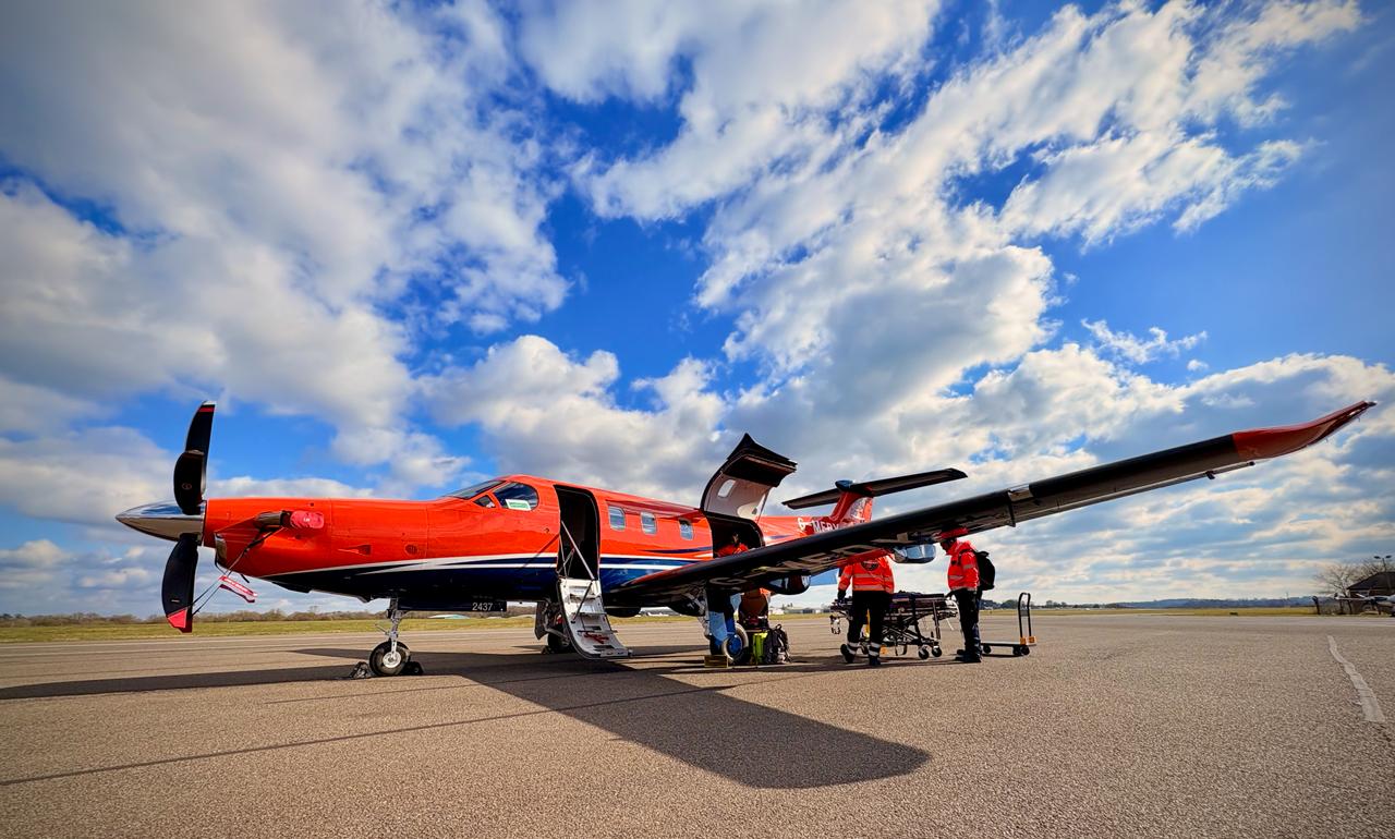 SkyCare air ambulance on the tarmac at Warsaw Chopin Airport ready for repatriation to the UK