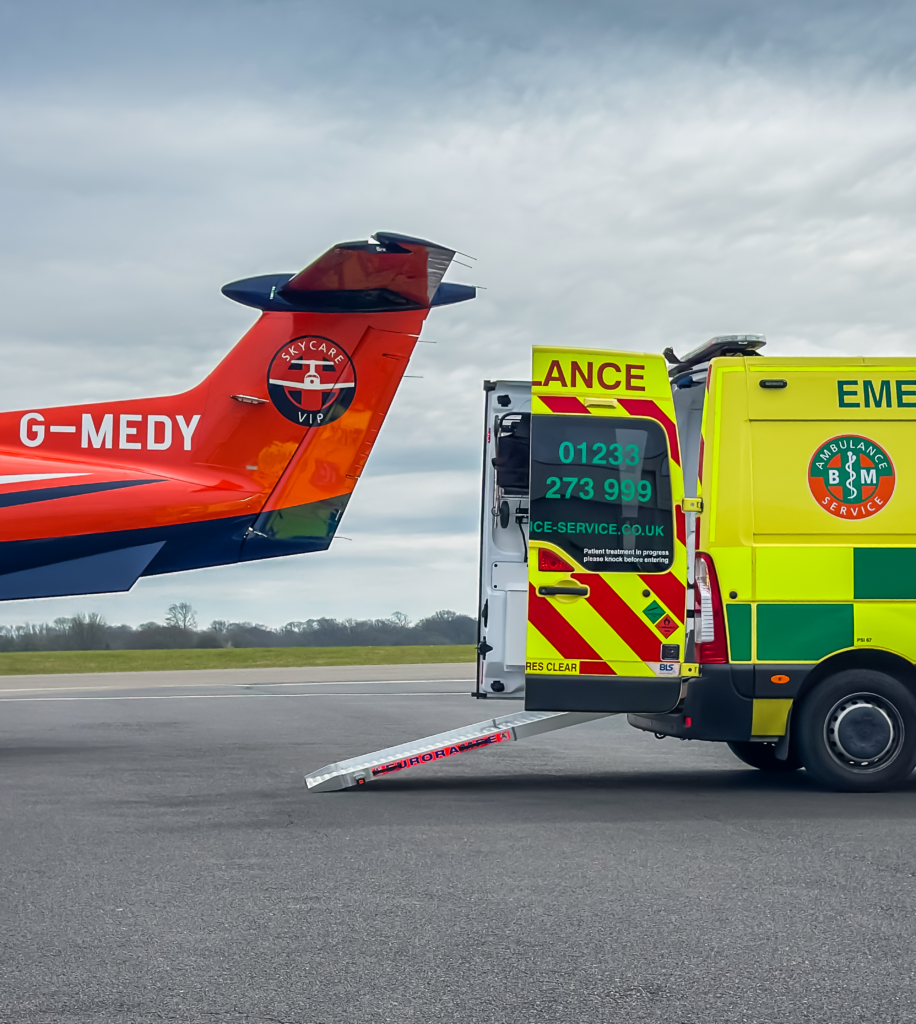 SkyCare air ambulance and ground ambulance preparing for patient transfer from Faro Airport in the Algarve, Portugal.