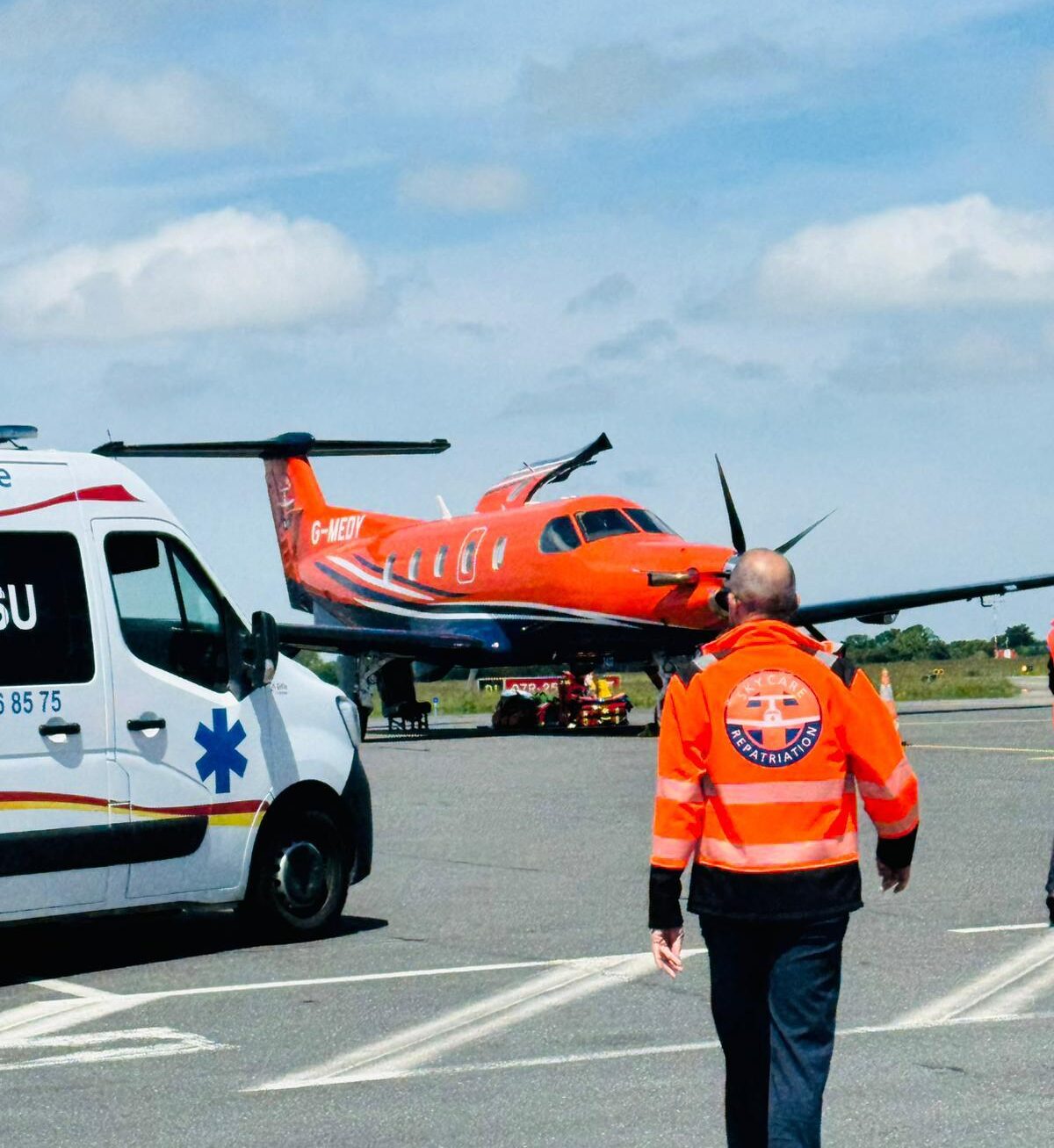 SkyCare air ambulance parked at Da Nang Airport preparing for medical repatriation to the UK