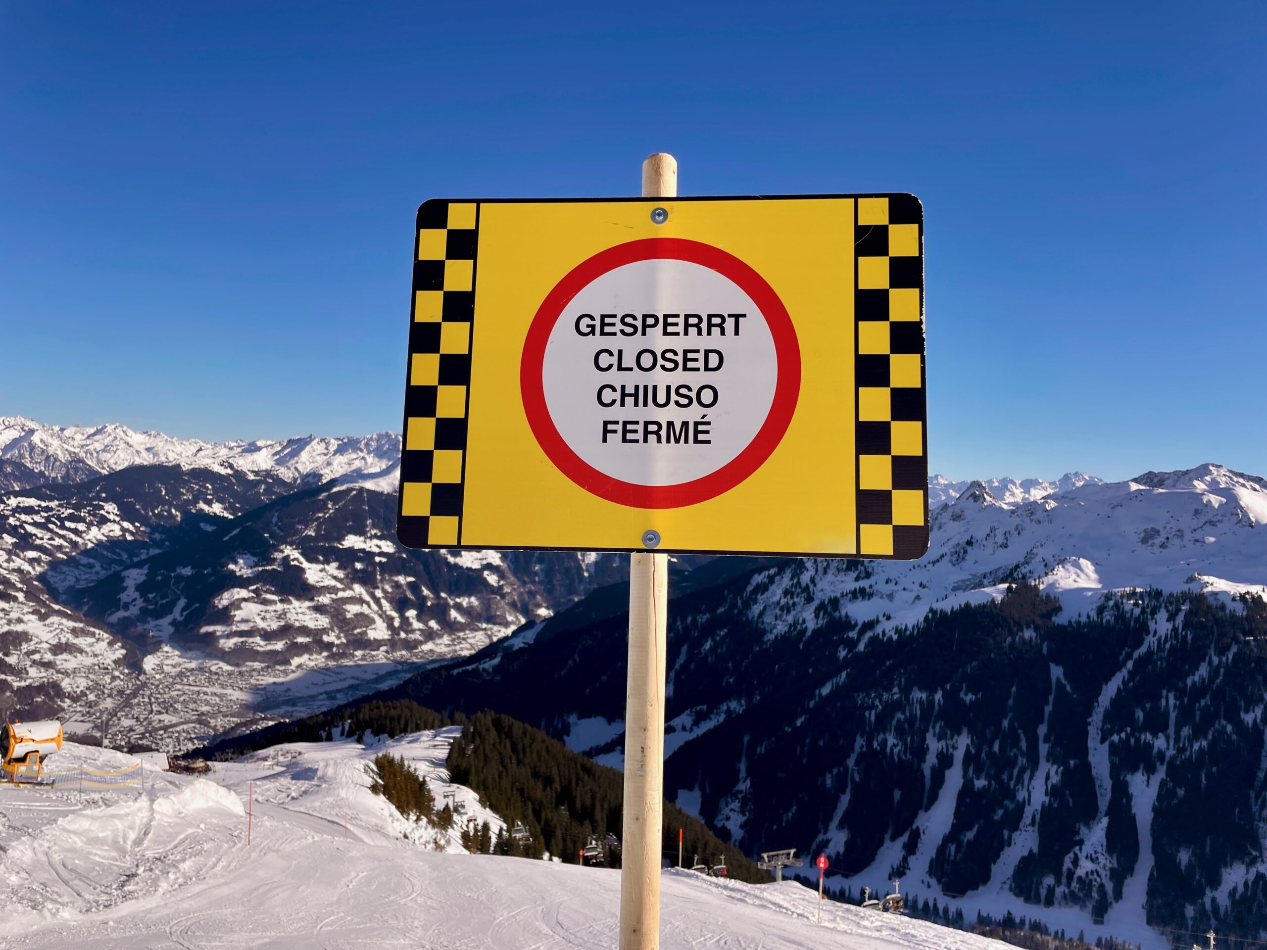 Closed ski run sign at Austrian resort warning of dangerous slope conditions Warning sign showing a closed ski run in an Austrian mountain resort due to dangerous conditions
