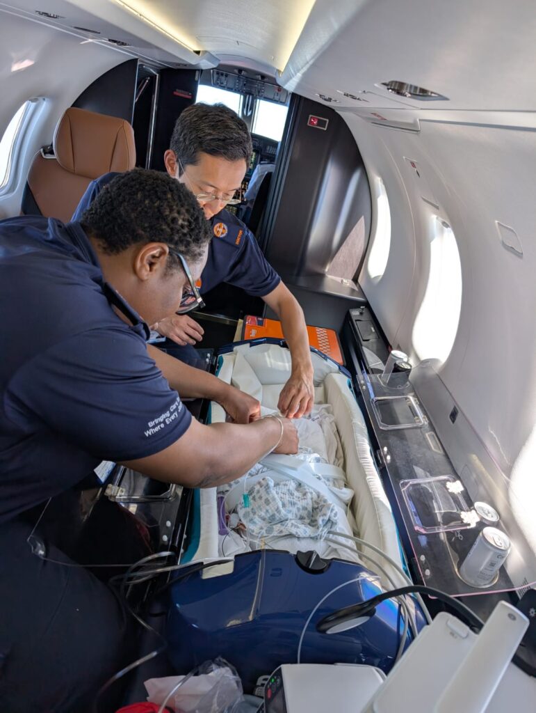 Specialist neonatal medical crew preparing for infant air repatriation
