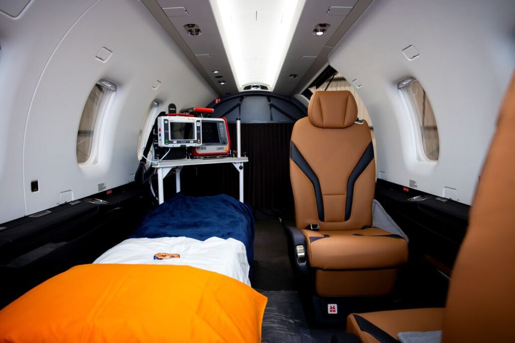 Interior of a UK-based private air ambulance with ICU equipment and medical team onboard