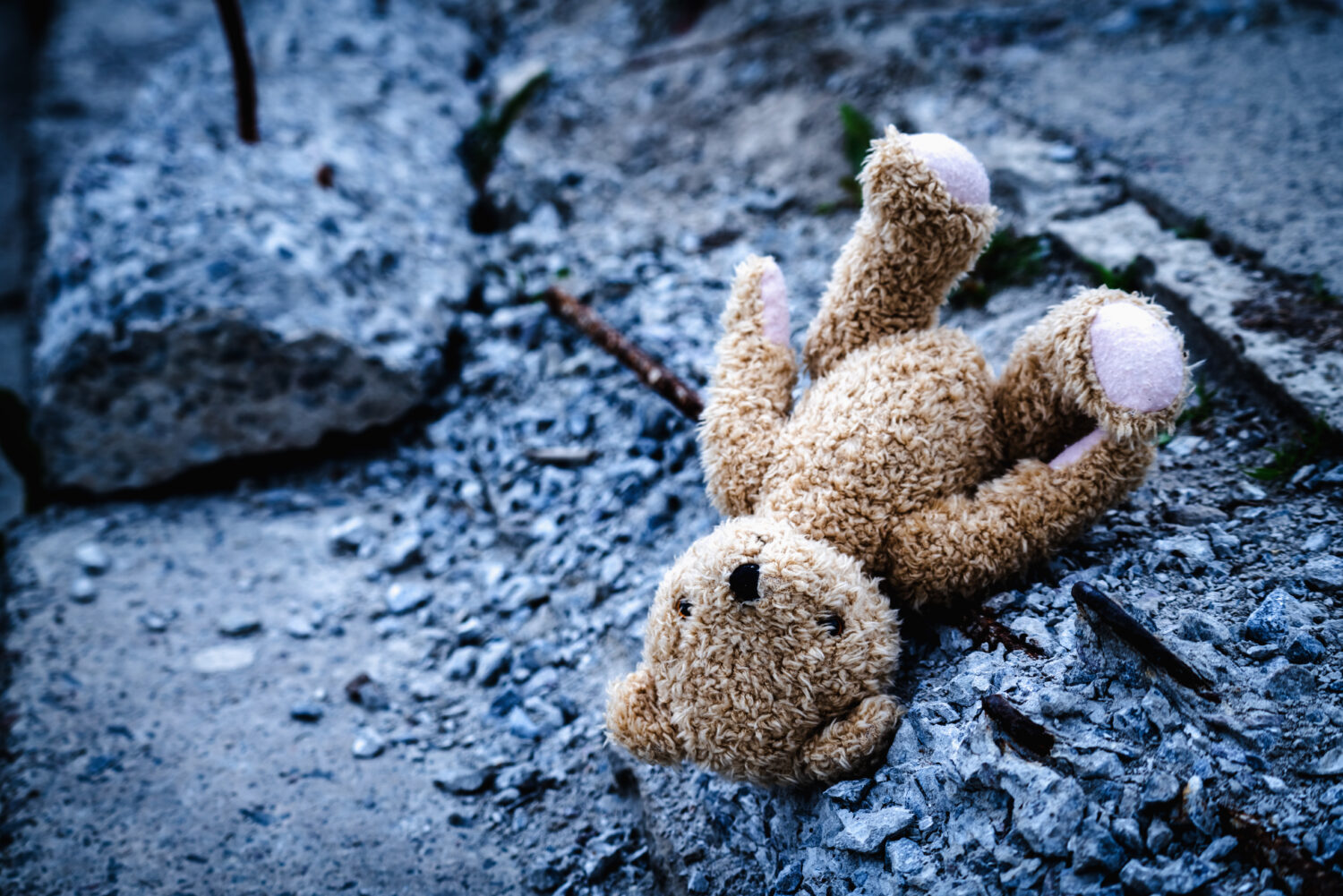 Child’s toy lying in rubble in Ukraine, symbolising need for medical evacuation and humanitarian aid