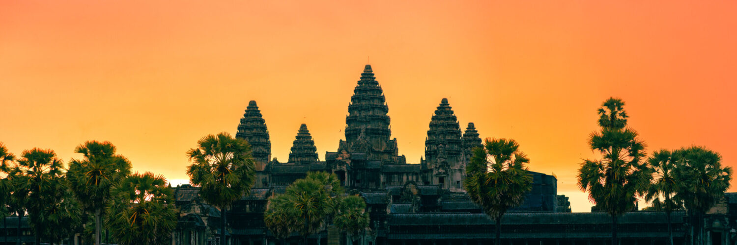 Air ambulance flying over Angkor Wat in Cambodia for urgent medical repatriation to the UK