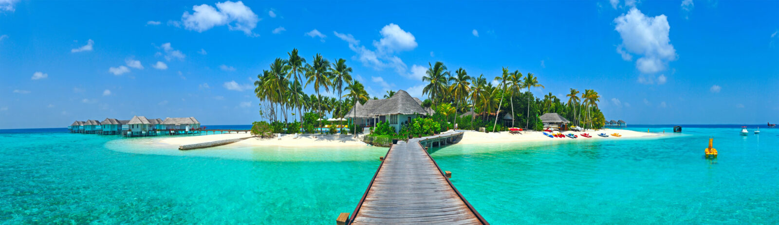 A luxury Maldives island with overwater villas and turquoise sea, ideal for medical evacuation services