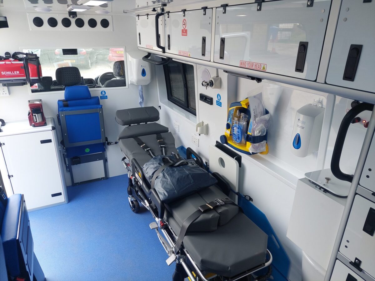 ILS ambulance in the UK with emergency lights, used for high-dependency patient transport and monitoring 