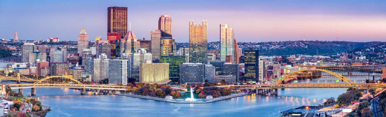 Pittsburgh skyline at dusk representing air ambulance services in Pennsylvania
