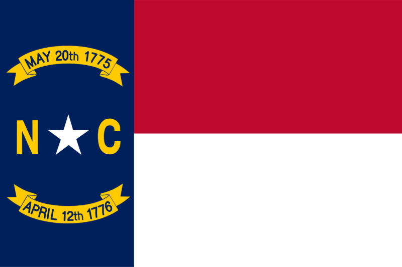 North Carolina flag displayed beside a medical aircraft used for international medical flights
