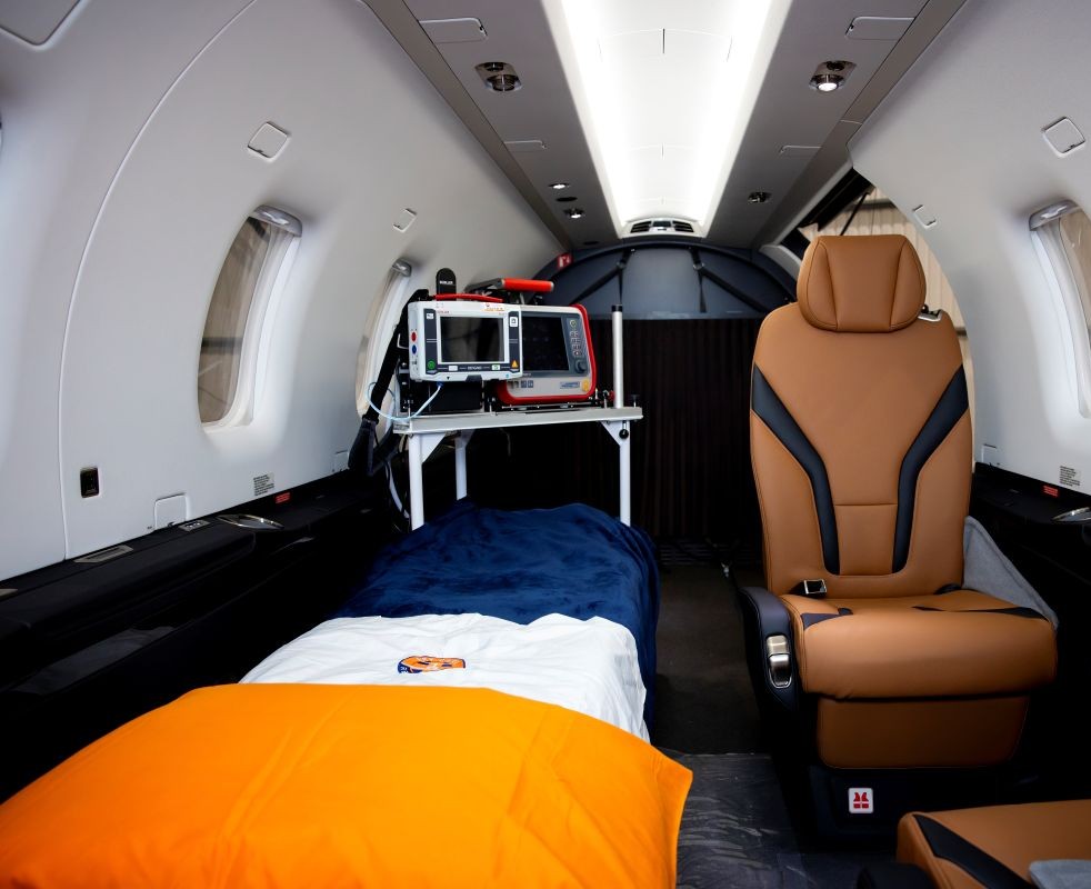 Medical evacuation team preparing patient for air ambulance departure from Montana