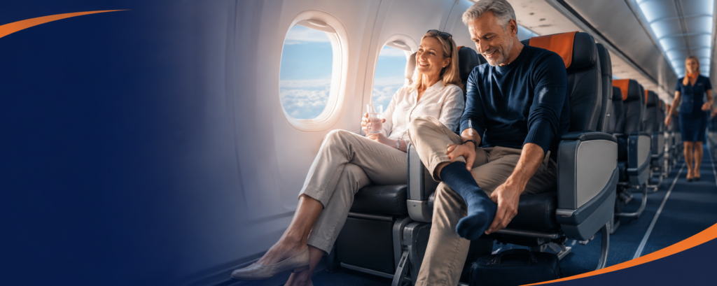 Passenger reducing the risk of DVT when flying by stretching their legs during a long-haul flight.