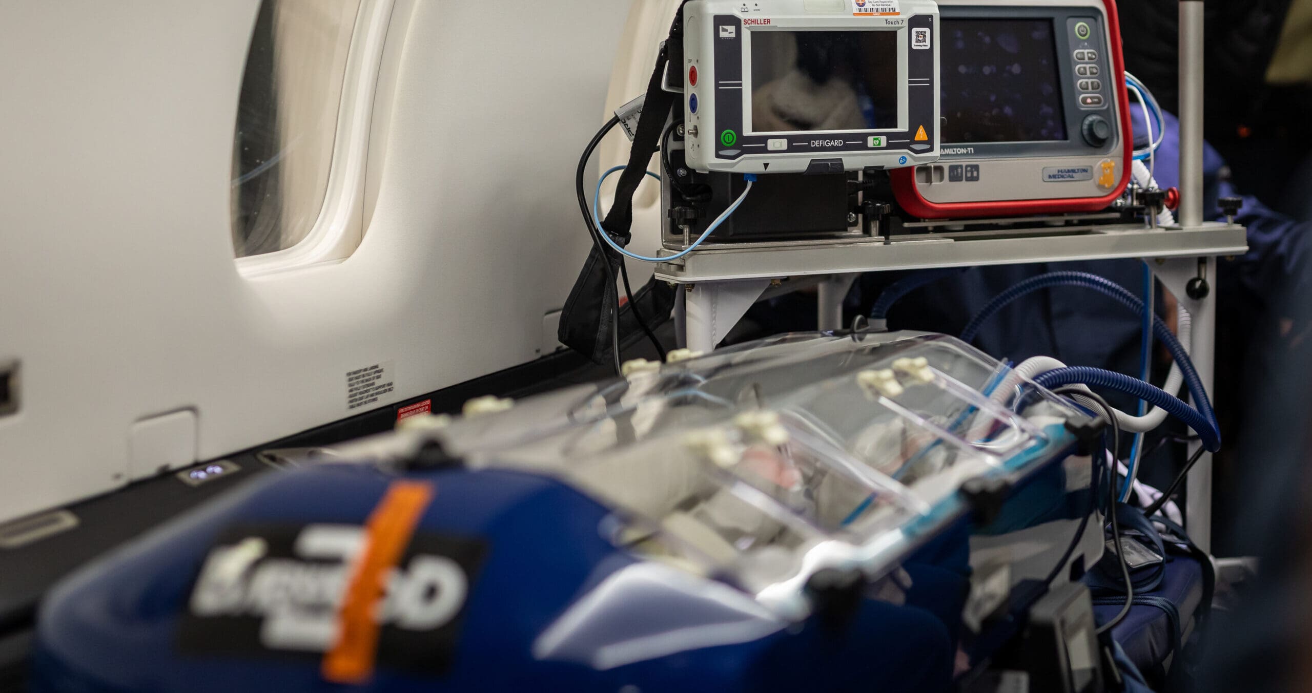 SkyCare specialist neonatal medical transport team preparing equipment for an international baby transfer 